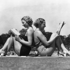 girls reading beach
